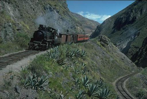 Mountain engine 58 has with a Mixto passed the lower setting-back track at the Devil's Nose and pushes the train uphill to the upper setting-back track, Ecuador.
