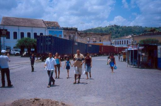 The cars disappear into the streets of Cachoeira, Brazil.