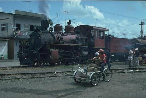 Lowland engine 11 (2-6-0, Baldwin, 1900) has arrived with a Mixto at Bucay, where the mountain locomotive will take over the train, Ecuador.